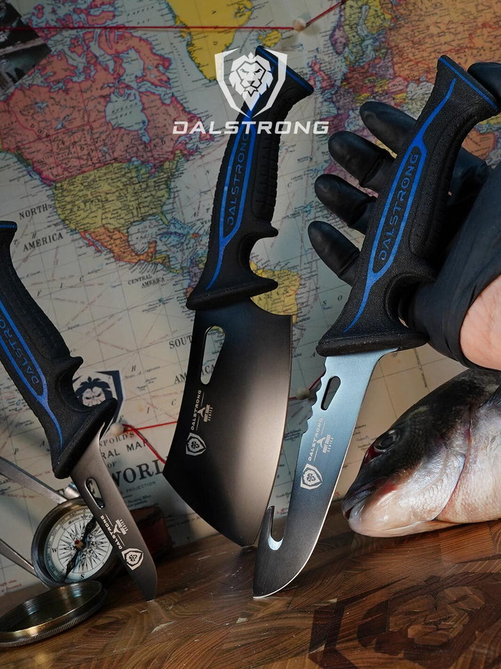 Dalstrong night shark series 3 piece knife set with water proof handles on a cutting board with fish.