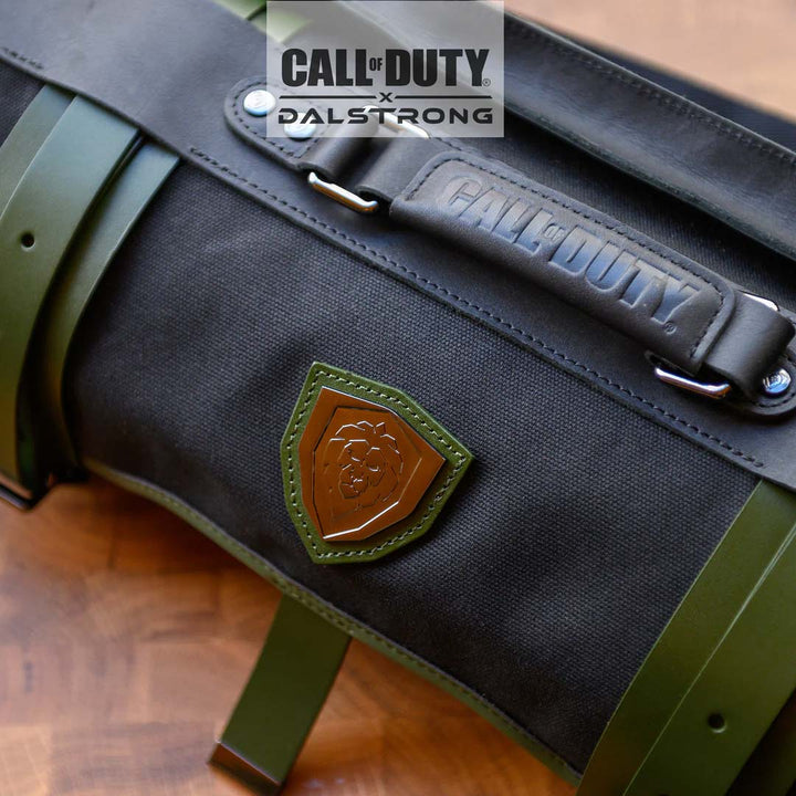 Dalstrong exclusive collector roll call of duty edition black waxed canvas knife roll featuring it's series and dalstrong logo.