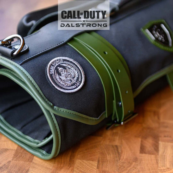 Dalstrong exclusive collector roll call of duty edition black waxed canvas knife roll showcasing it's exterior design.