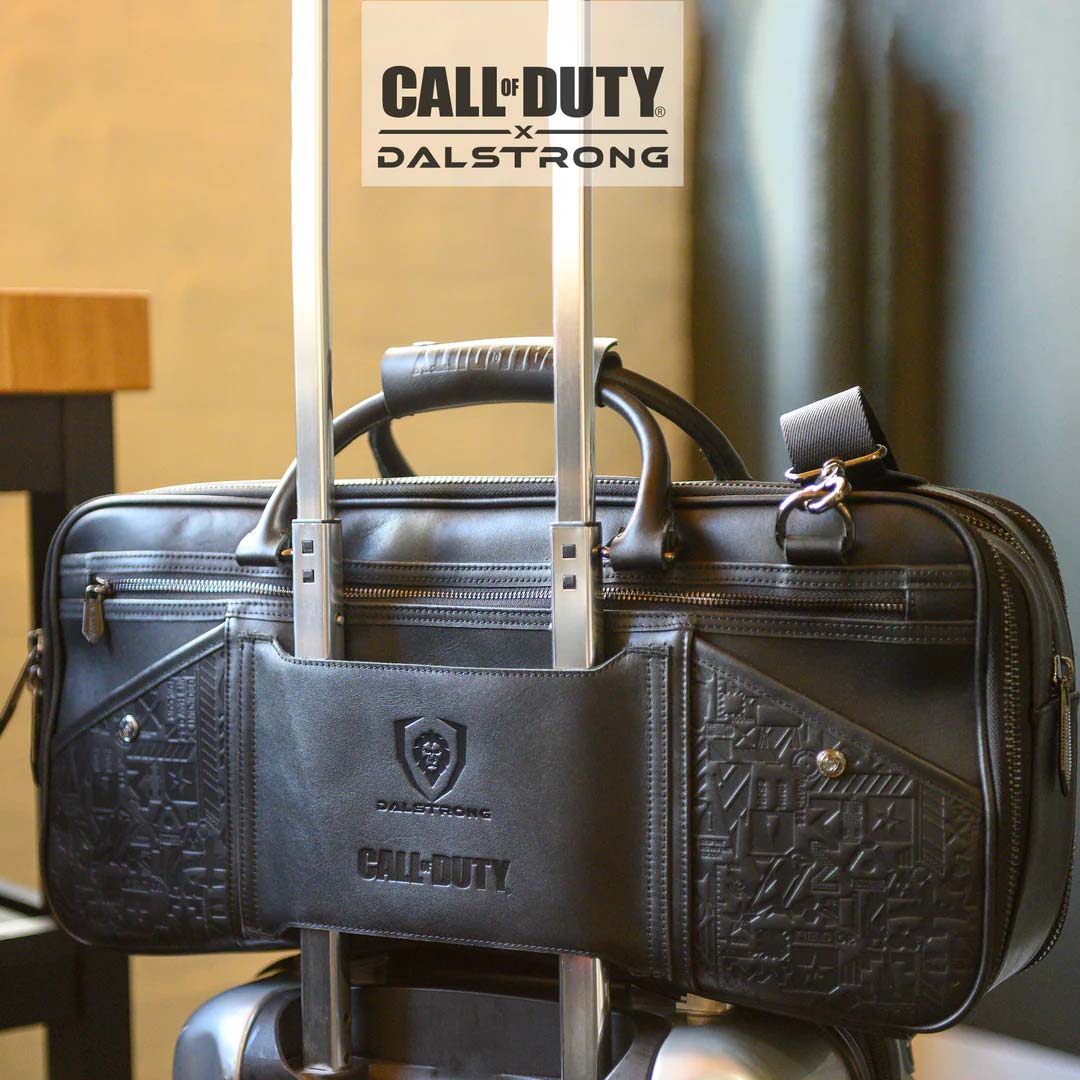 Dalstrong call of duty exclusive collector and limited edition black genuine leather knife bag on a travel bag.