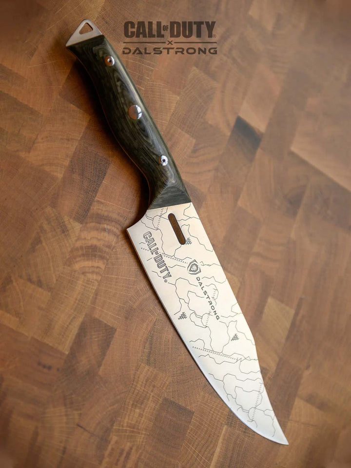 Dalstrong call of duty series 8 inch chef knife on a cutting board.