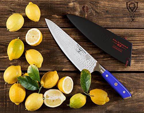 Dalstrong shogun series 8 inch chef knife with blue handle and black sheath with lemons on the side.