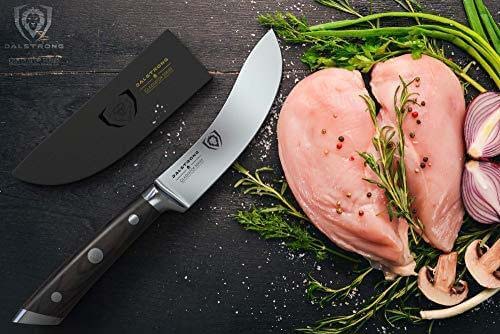 Dalstrong gladiator series 5.5 inch skinning and boning knife with black handle and sheath beside two chicken fillets.
