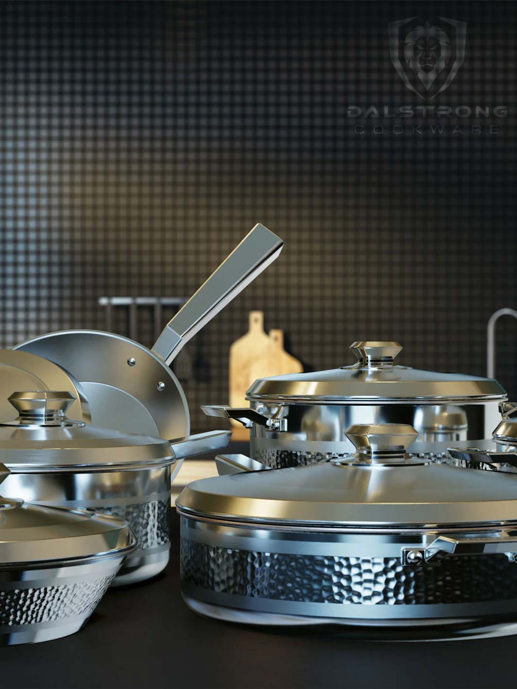 Dalstrong avalon series 12 piece cookware set silver on a kitchen table.