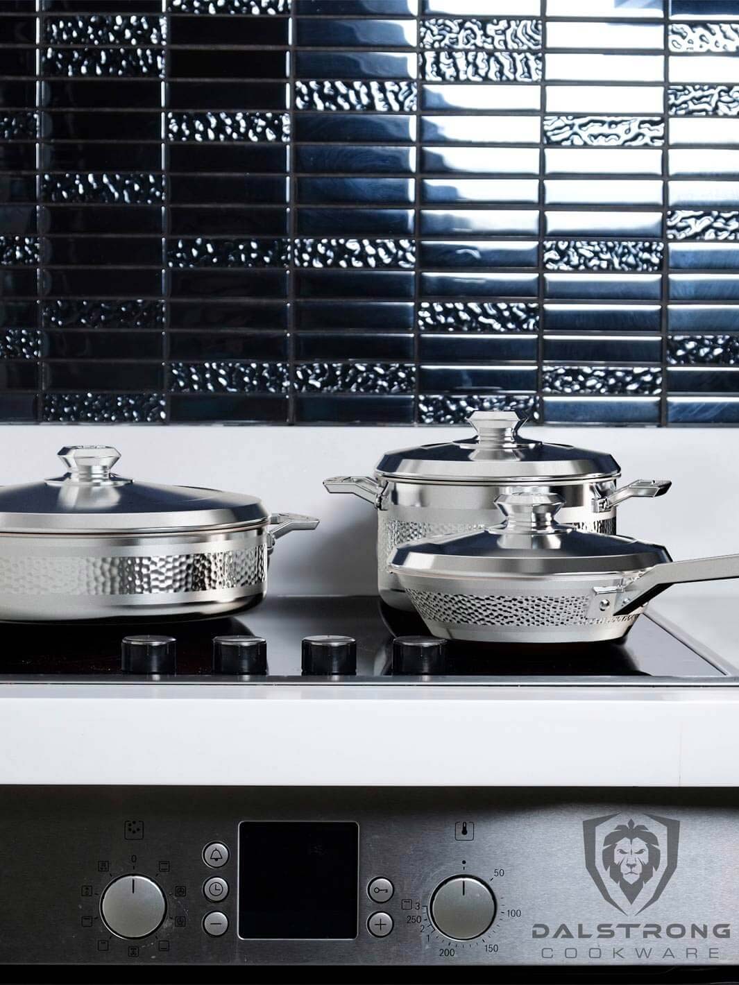 Dalstrong avalon series 6 piece cookware set silver on a stovetop.