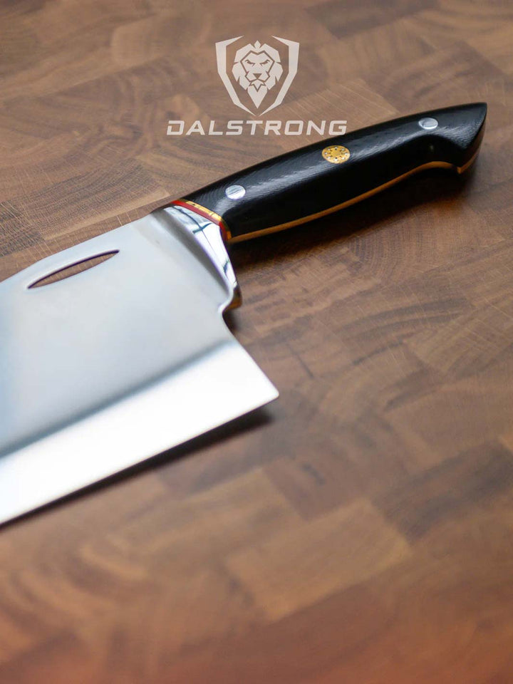 Dalstrong centurion series 7 inch cleaver knife with black handle on a cutting board.