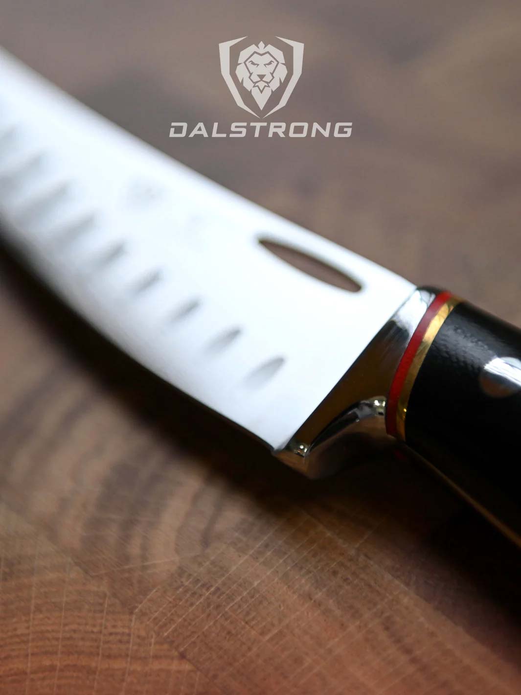 Dalstrong centurion series 6 inch curved boning knife on a cutting board.