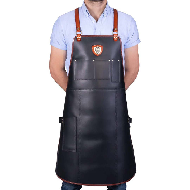 A man wearing the Dalstrong the culinary commander professional chef's kitchen apron.