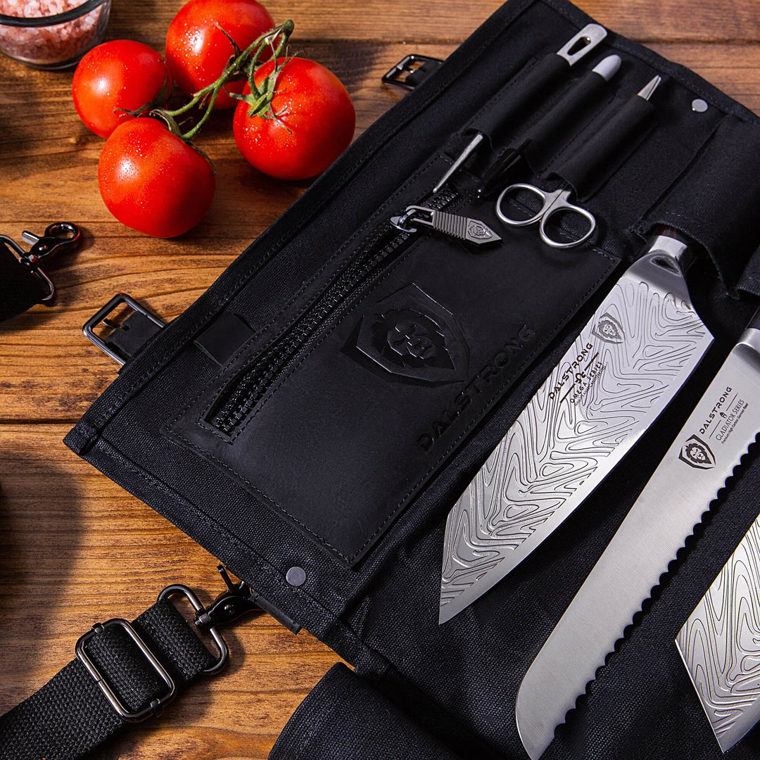 Dalstrong 12oz heavy-duty canvas and leather night master black nomad knife roll with knives inside.