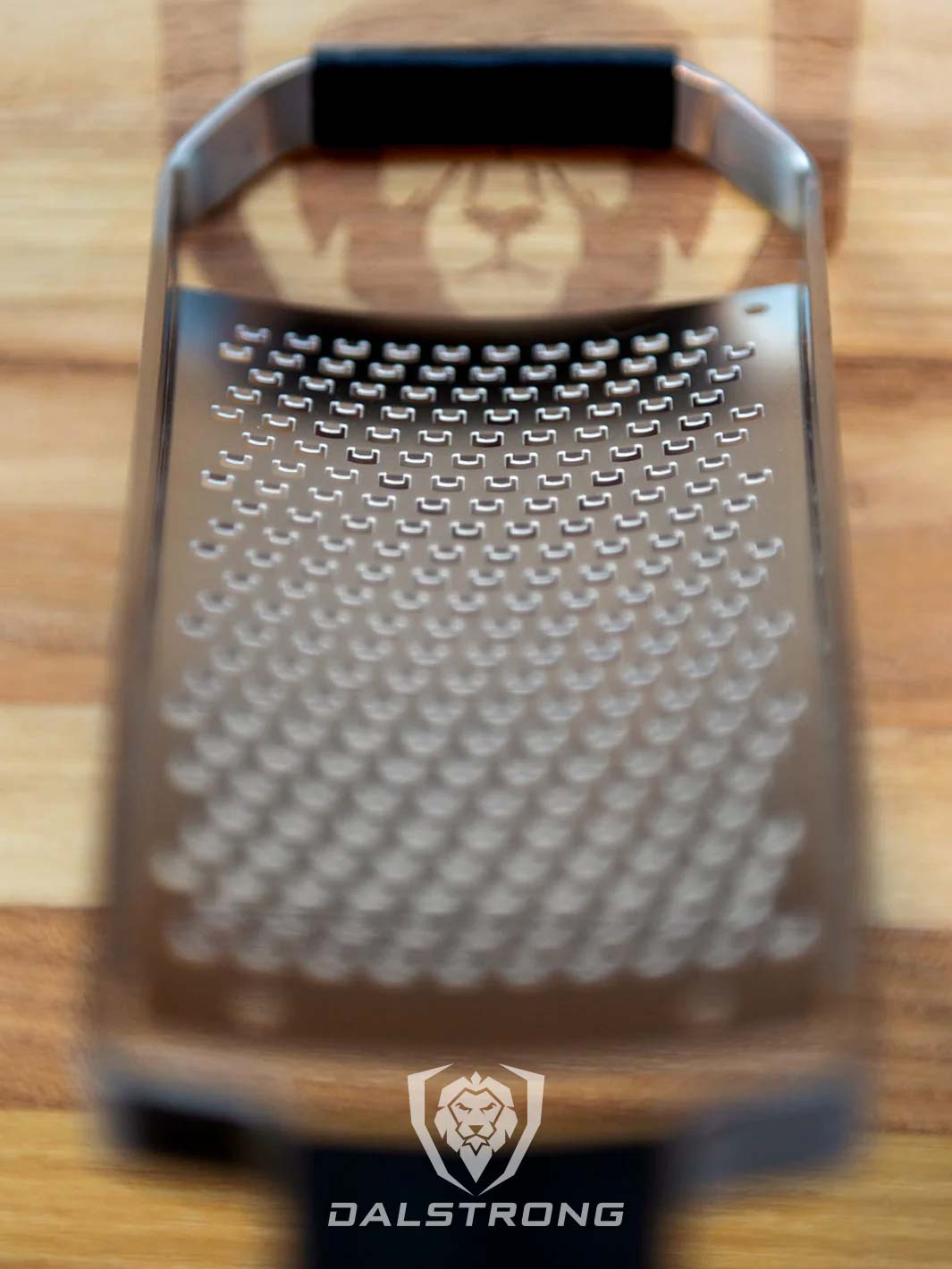 Dalstrong professional coarse wide cheese grater showcasing it's stainless steel grater.