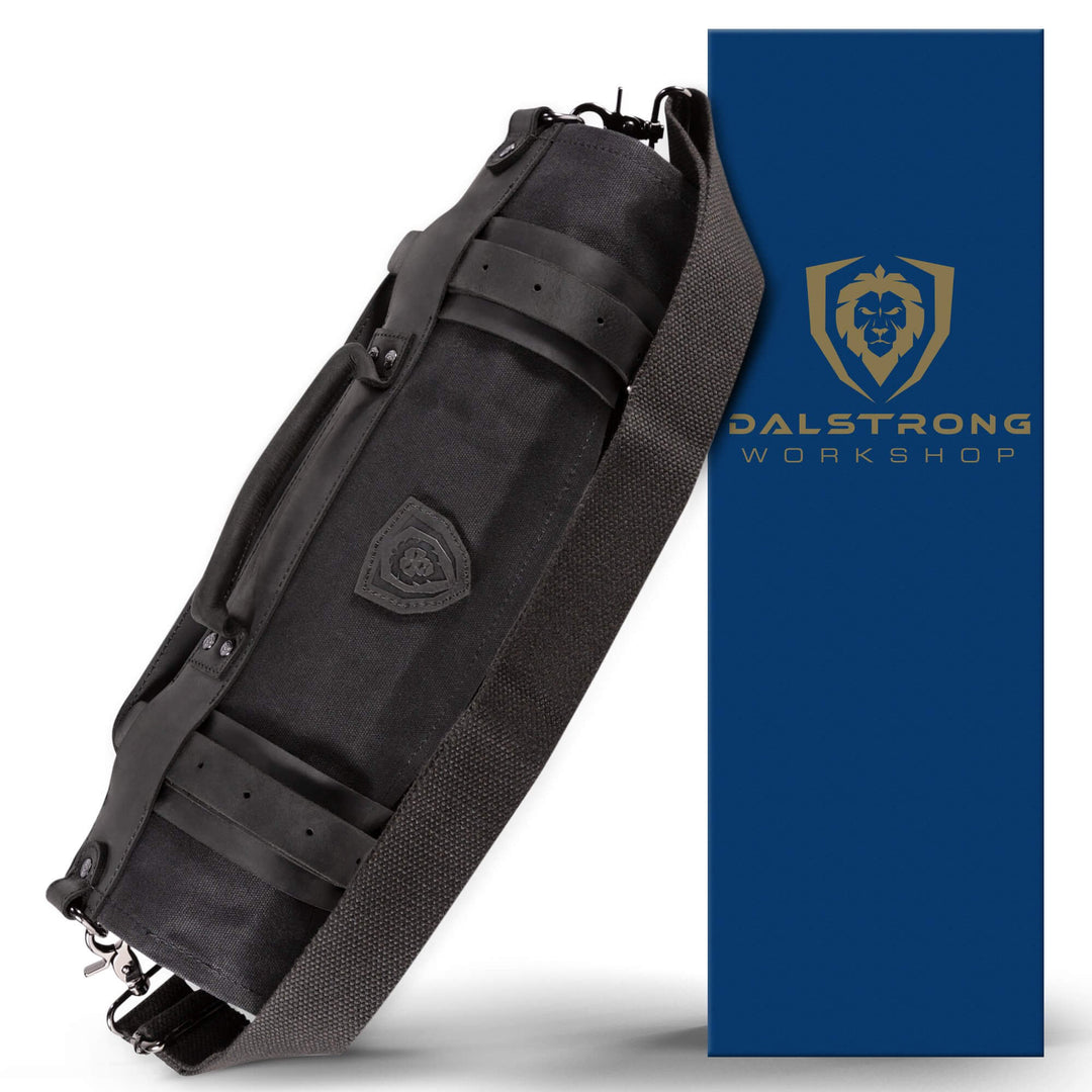 Dalstrong 12oz heavy-duty canvas and leather night master black nomad knife roll in front of it's premium packaging.