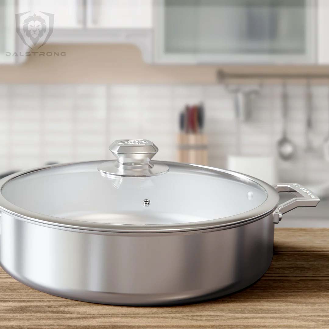 Dalstrong oberon series 12 inch silver saute frying pan on top of a table.