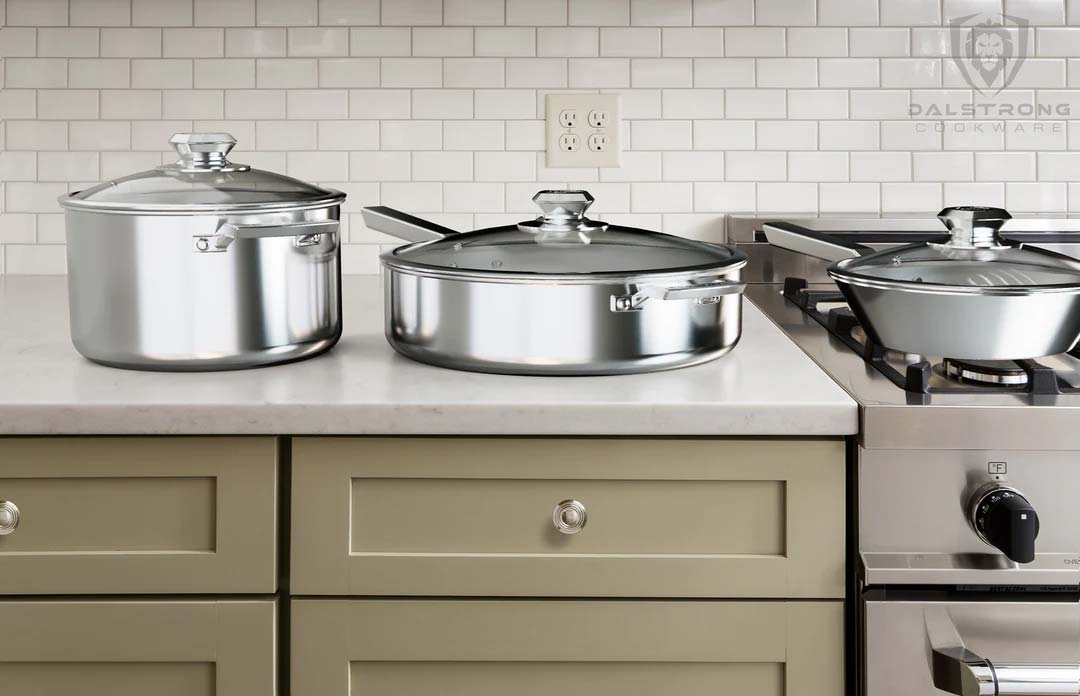Dalstrong oberon series 6 piece cookware set on a kitchen table.