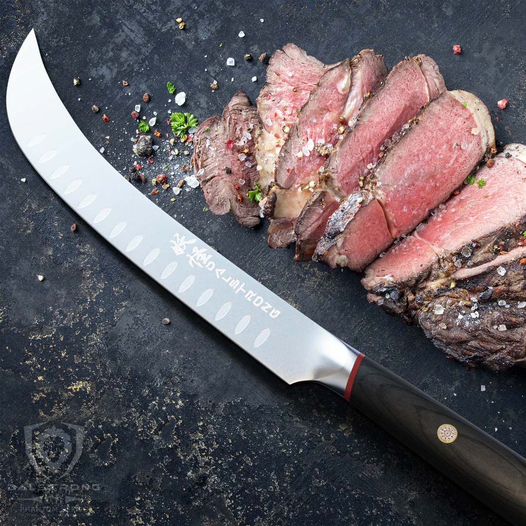Dalstrong phantom series 10 inch butcher knife with pakka wood handle and slices of steak at the side.