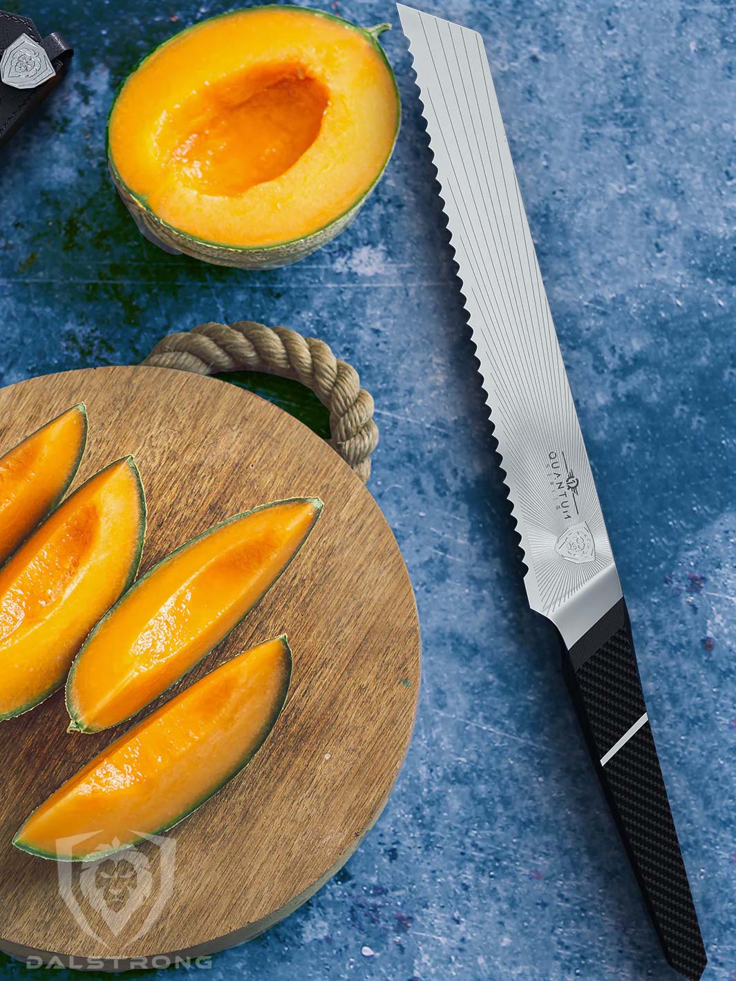 Dalstrong quantum 1 series 9 inch bread knife with slices of cantaloupe on a cutting board.