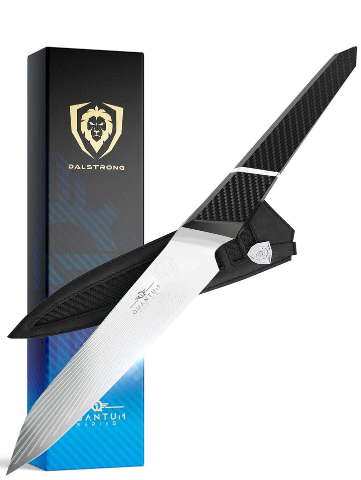 Dalstrong quantum 1 series 6 inch utility knife with dragon skin handle in front of it's premium packaging.