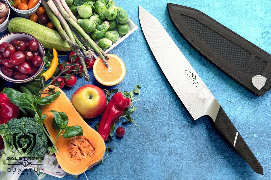 Dalstrong quantum 1 series 8 inch chef knife with dragon skin handle beside a butternut squash and fruits.