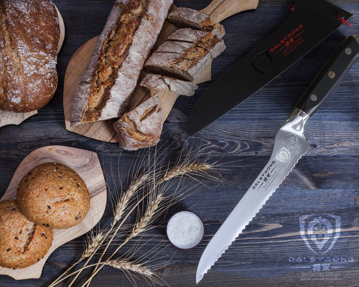 Dalstrong shogun series 8 inch offset slicer knife with three kinds of bread on the other side.