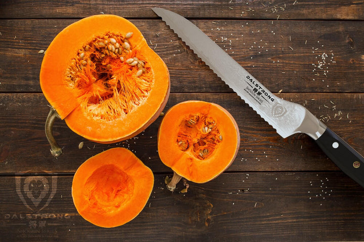 Dalstrong shogun series 8 inch offset slicer knife with black handle and slices of squash beside it.