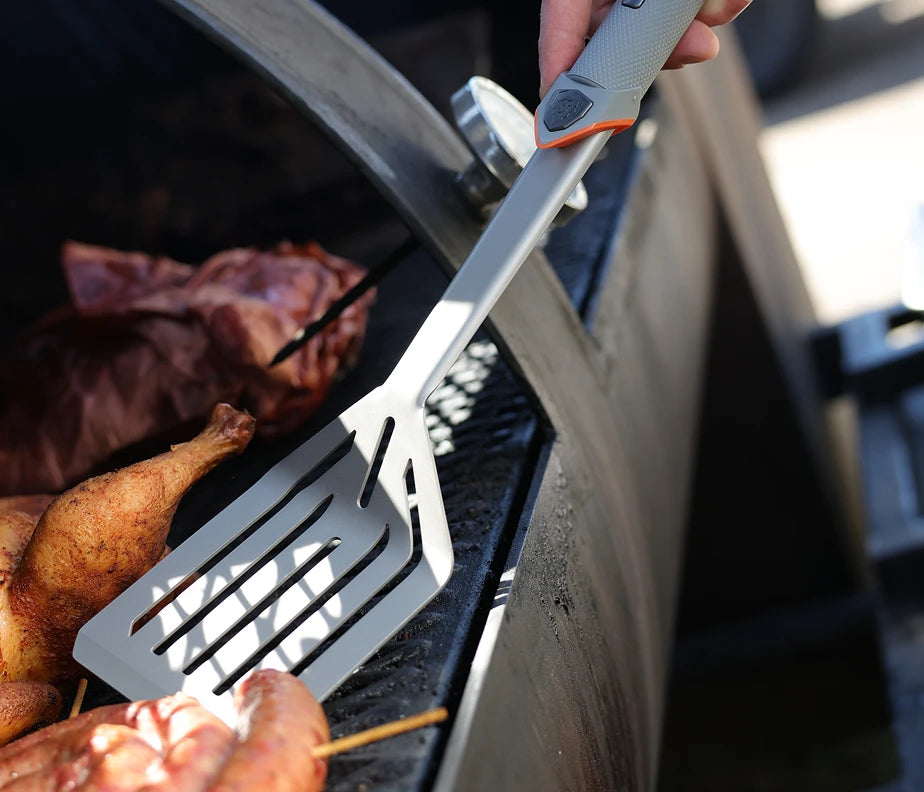 <h6>Heat and corrosion, handled.</h6><p>The Titanium Nitride coating boosts the steel’s resistance to both, keeping the spatula in working condition through years of direct-flame cooking.</p>