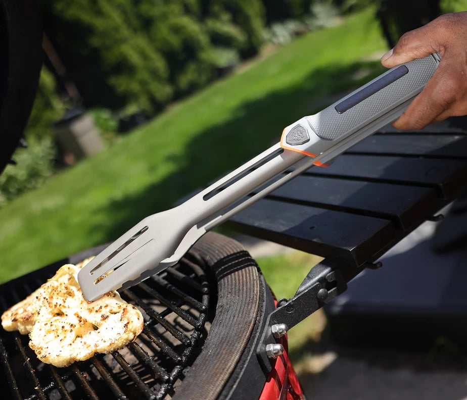 <h6>No backing off the fire.</h6><p>Reach into the flame, lean over the coals, work close to the grates. The tools take it.</p>