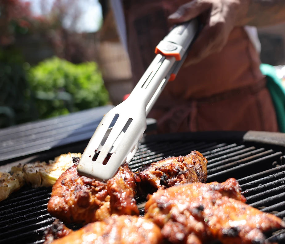<h6>The two tools in your hands through the cook.</h6><p>The spatula flips, lifts, and slides under whatever needs turning. The tongs grab, hold, and reposition without crushing. Most of the action at the fire happens between these two. Engineered together so they work the same way in your hand.</p>