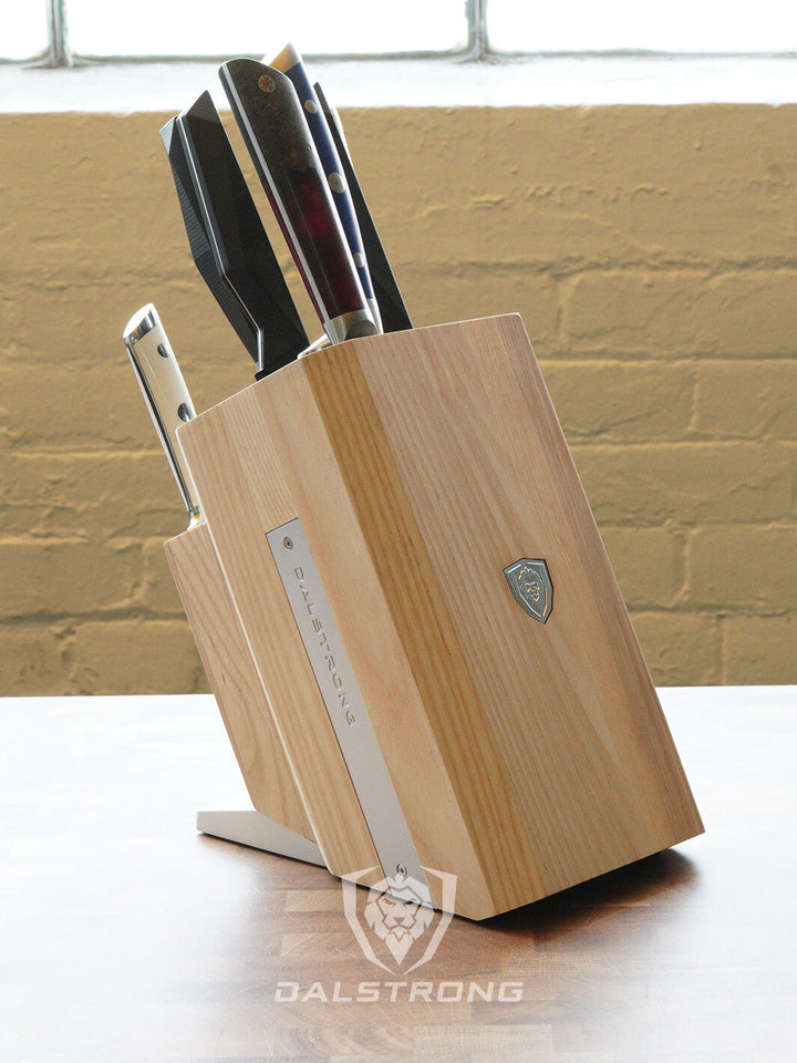 Dalstrong 18 slots universal knife block with knives inside.
