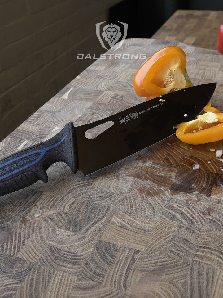 Dalstrong night shark series 8 inch chef knife with shark skin handle with a bell pepper cut in half on a cutting board.
