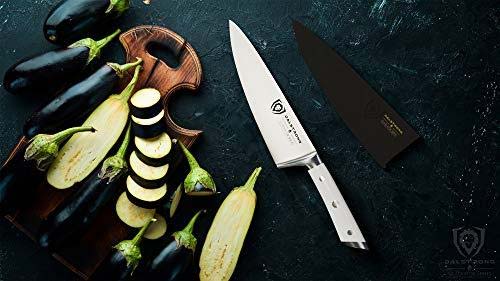 Dalstrong gladiator series 8 inch chef knife with white handle and slices of eggplants on a wooden board.
