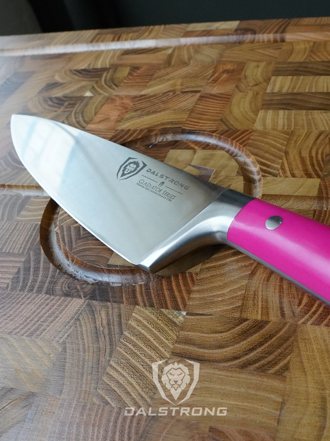 Dalstrong gladiator series 8 inch chef knife with fushia handle in top of a dalstrong wooden cutting board.