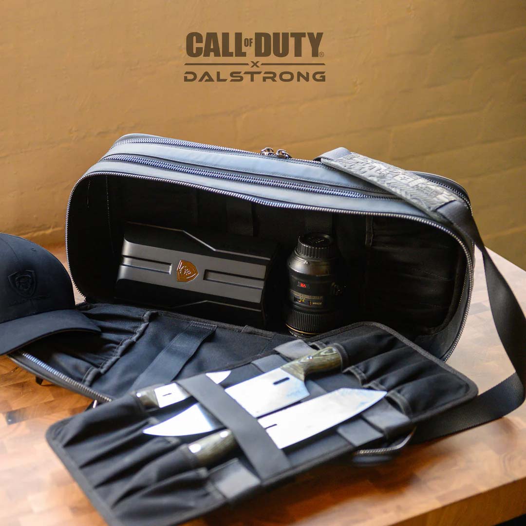 Dalstrong call of duty exclusive collector and limited edition black genuine leather knife bag with knives and a cap.