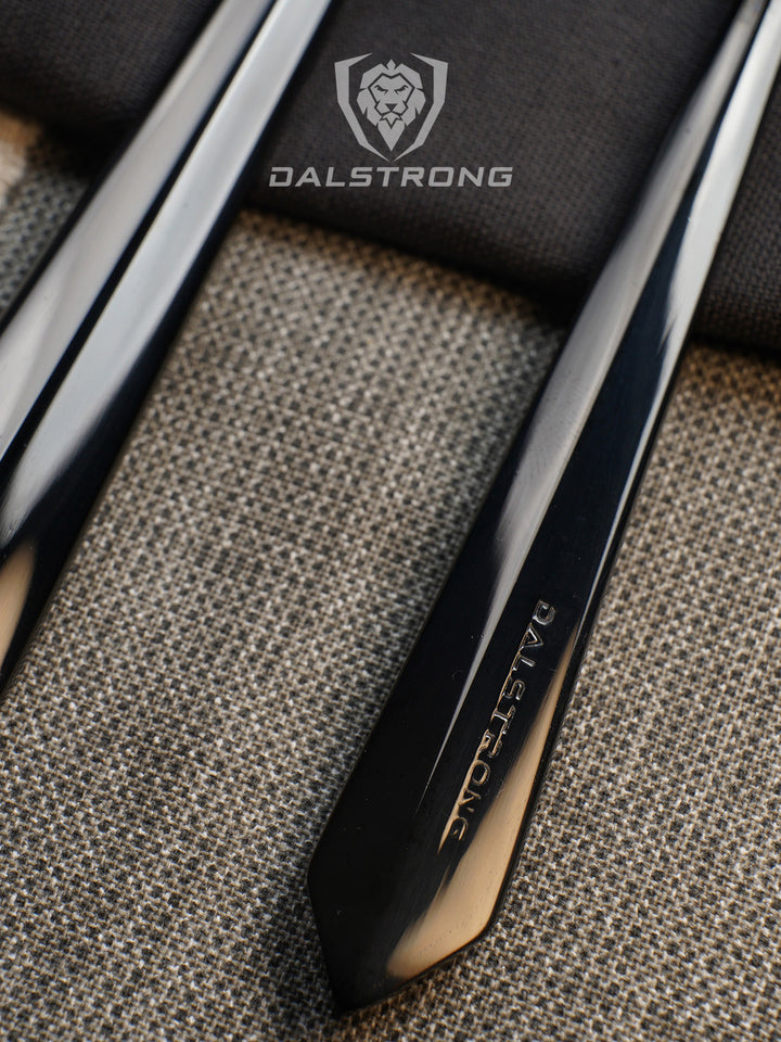 Dalstrong 20 piece flatware cutlery set black stainless steel service of 4 featuring it's handle with dalstrong name engraved on it.