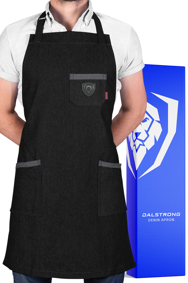 Dalstrong the night rider professional chef's kitchen apron in front of it's premium packaging.