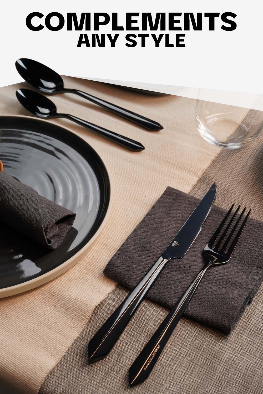Dalstrong 20 piece flatware cutlery set black stainless steel service of 4 on a table with a black plate.
