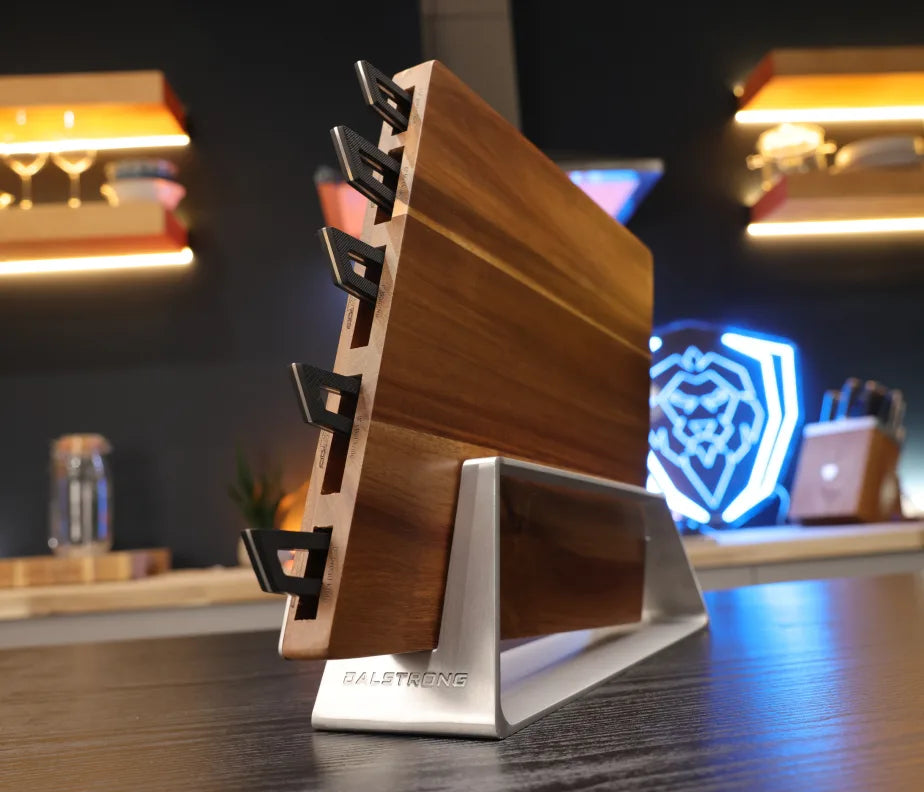 <h6>A system, not a block.</h6><p>Five precision-engineered knives, a sculpted acacia block, and a modular stainless dock, designed together so the whole thing configures around your kitchen rather than the other way around.</p><h6>Where the form is part of the function.</h6><p>Every decision in the design does two jobs at once. Thin enough to disappear, sculpted enough to leave out.</p>