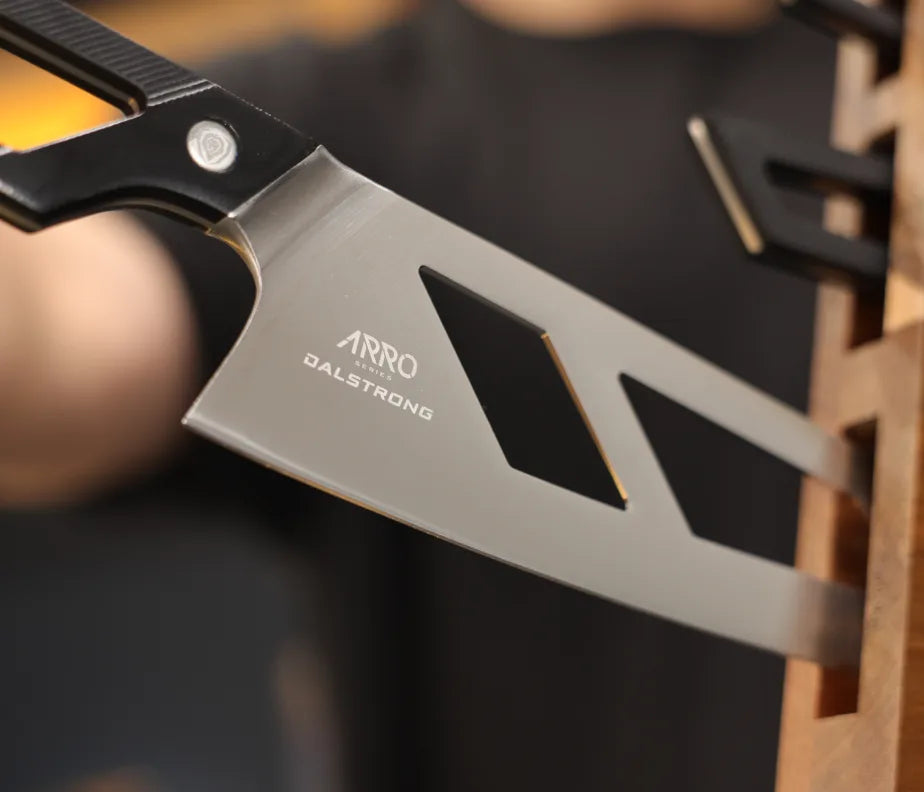 <h6>Guided in, held steady.</h6><p>A magnet in every slot draws each blade the last of the way in and holds it there. You get a small register of feedback as it seats, and it stays put until you reach for it.</p><h6>Every knife has a home.</h6><p>Each slot is marked in the wood with the knife it takes, so there's no guessing and no forcing a blade into the wrong space.</p><h6>Protected between uses.</h6><p>Held in its own slot, each blade stays clear of other steel. No knocking against neighbors in a drawer, no edge damage in storage, so knives stay sharper for longer.</p>