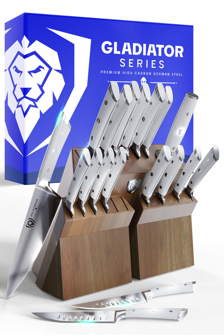 Dalstrong gladiator series 18 piece knife set with white handles and block in front of it's premium packaging.