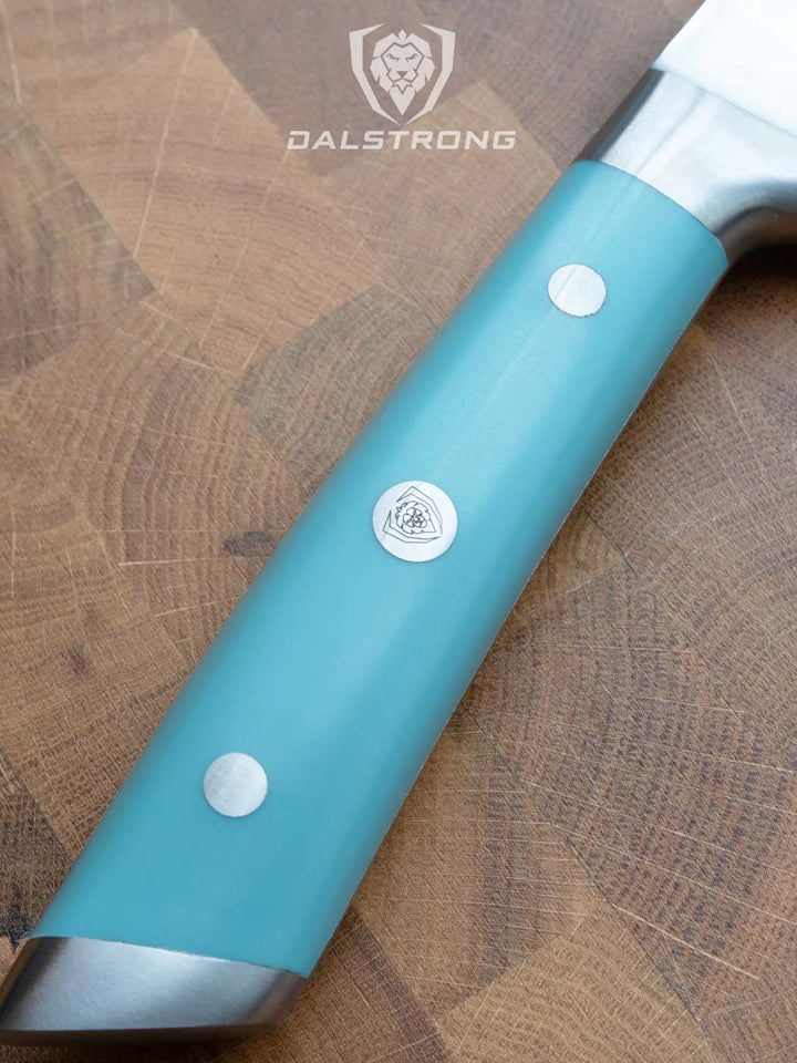 Dalstrong gladiator series 8 inch chef knife showcasing it's ergonomic aegeal teal handle with the dalstrong logo in the middle.
