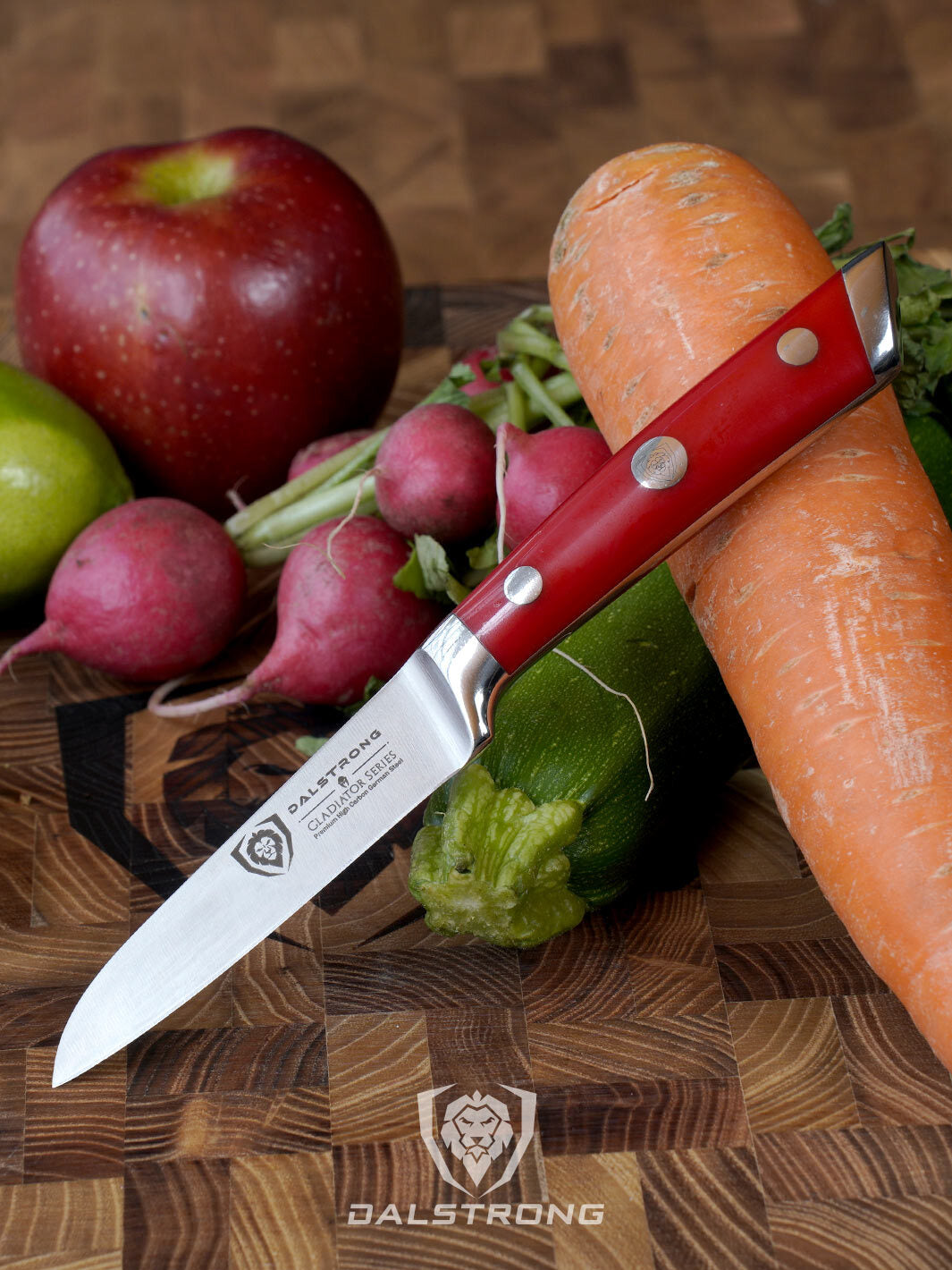 Dalstrong gladiator series 3.5 inch paring knife with red handle and vegetables on a cutting board.