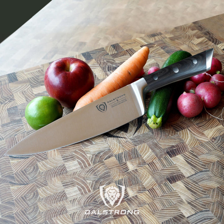 Dalstrong gladiator series 8 inch chef knife with faux wooden handle with vegetables on a cutting board.