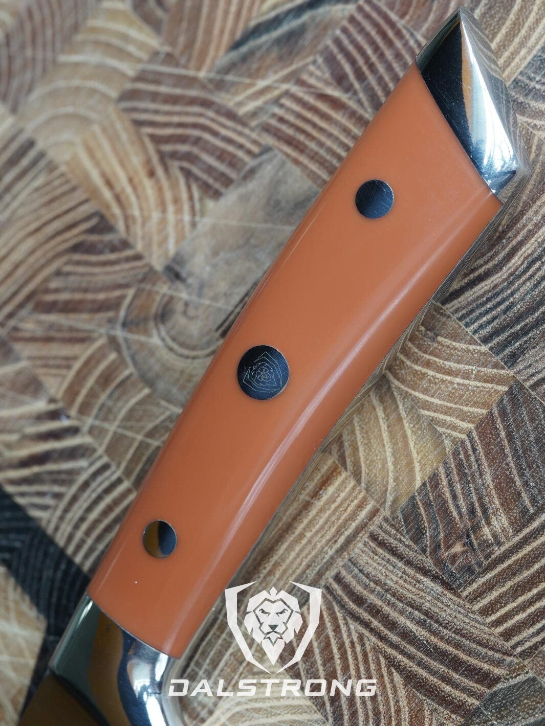 Dalstrong gladiator series 8 inch chef knife showcasing it's ergonomic ABS orange handle and dalstrong logo in the middle.