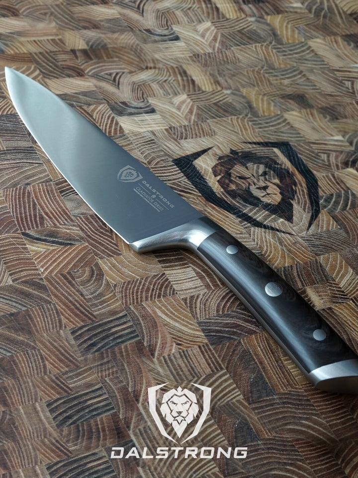 Dalstrong gladiator series 8 inch chef knife with faux wood handle on top of a dalstrong cutting board.