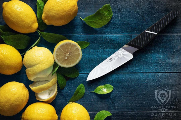 Dalstrong quantum 1 series 4 inch paring knife with dragon skin handle and lemons on the side.