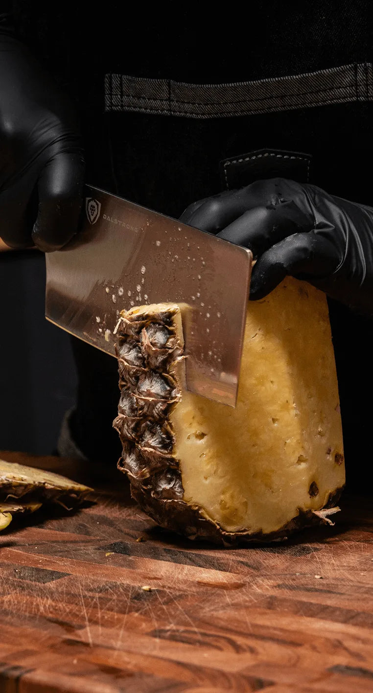 The cleaver, preparing fresh pineapple.