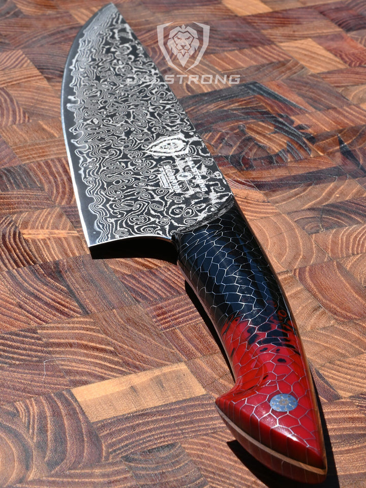 Dalstrong scorpion series 9.5 inch chef knife with red handle on a cutting board.