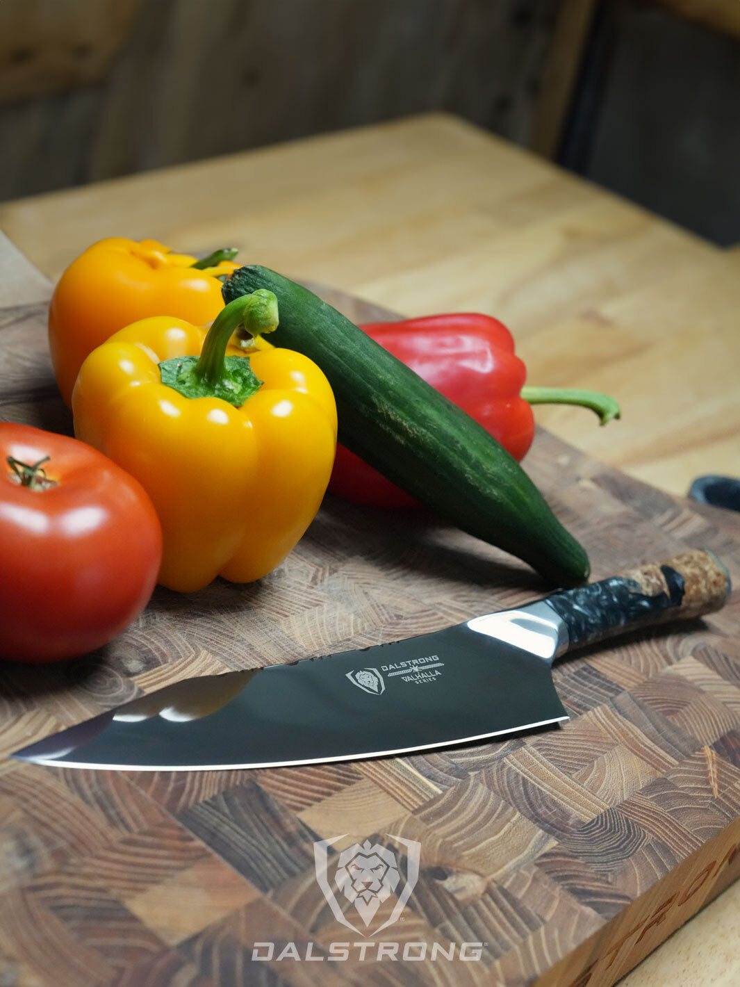 Dalstrong Valhalla Series 8 inch chef knife ravenstone edition beside some vegetables on a cutting board.