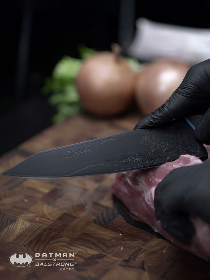 Dalstrong shadow black series 2 piece knife set batman edition with a cut of meat.