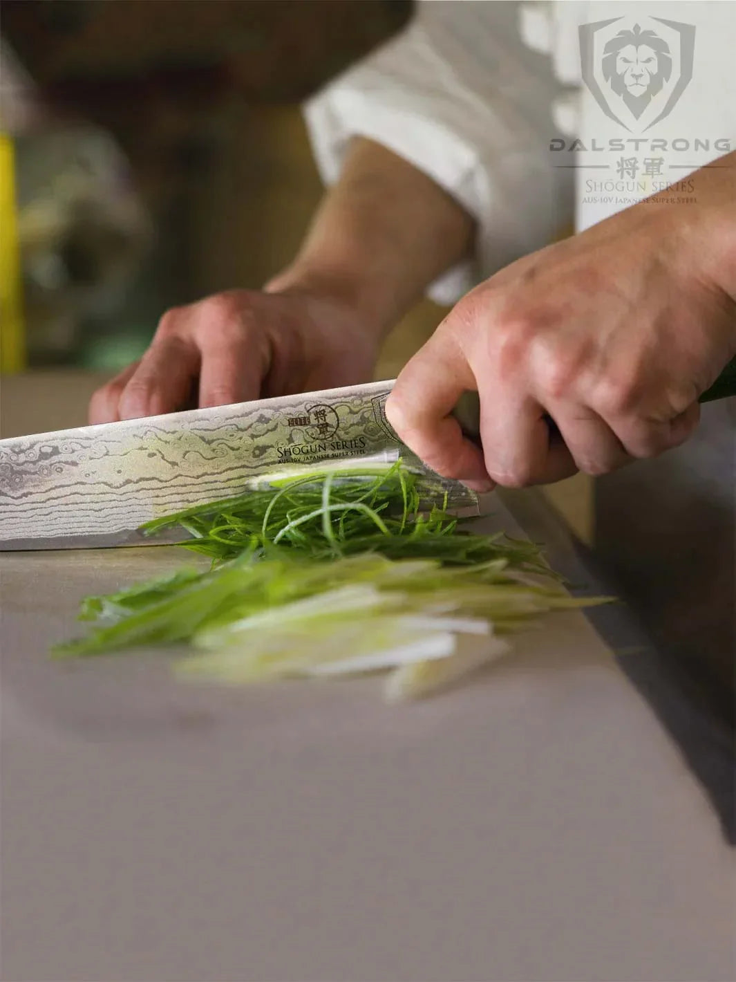 Shogun chef’s knife preparing vegetables on a board