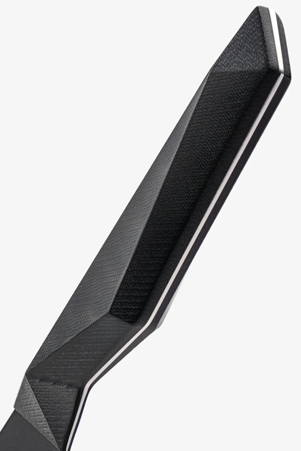 Close-up of the angular black G10 handle on the Shadow Black chef’s knife