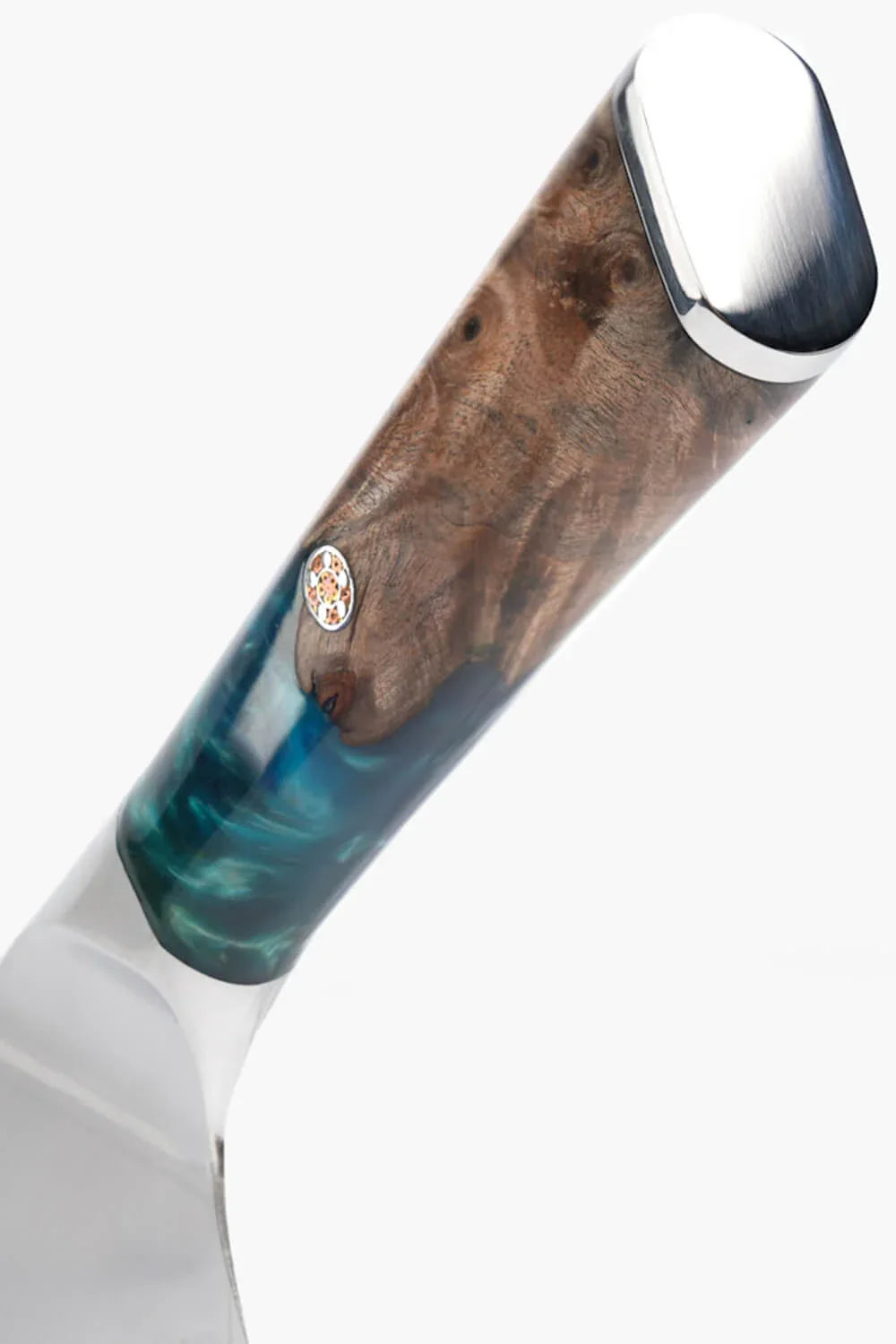 Close-up of the Valhalla chef’s knife wood-and-resin handle and bolster